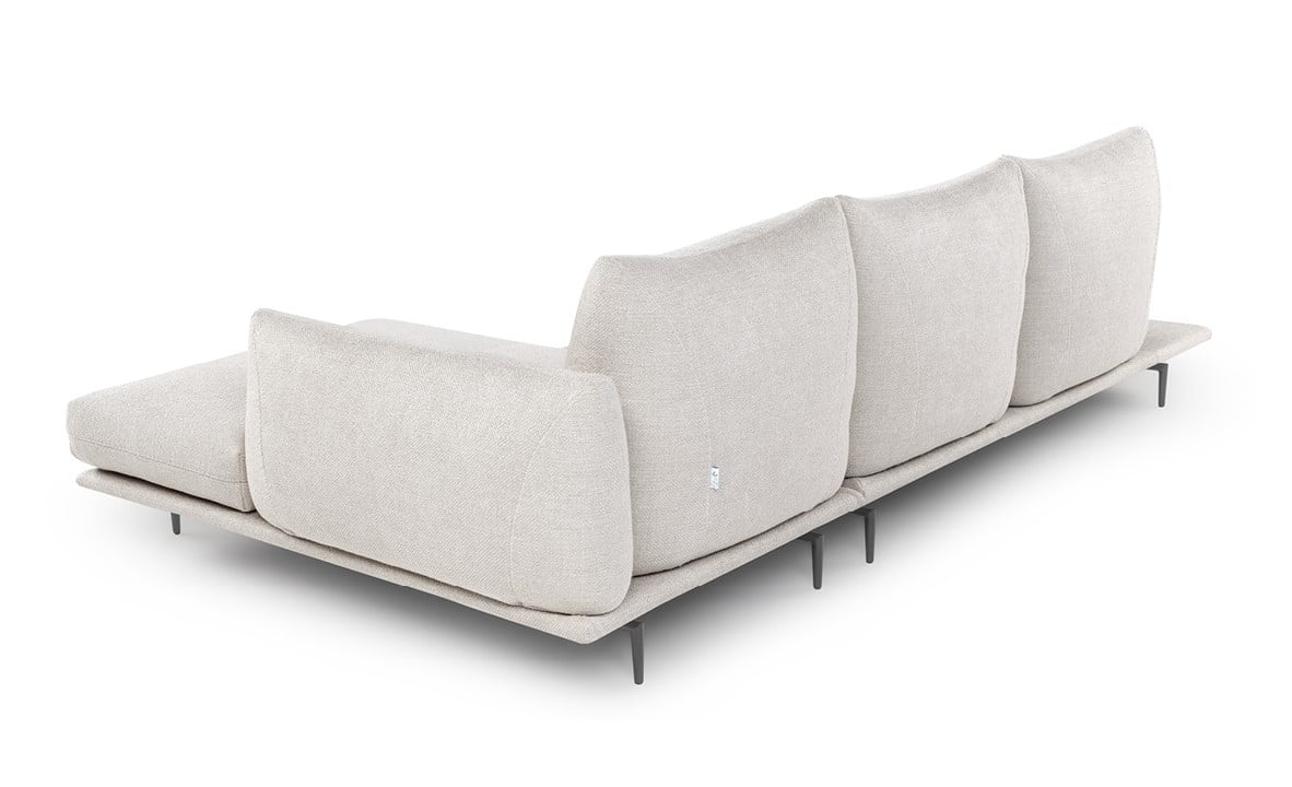 Elegant sectional with heightened backrests for superior comfort, minimal base, and decorative stitching, combining sophistication with supported relaxation. | Dragées by Calia Italia