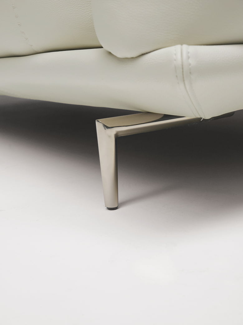 Elegant sectional with heightened backrests for superior comfort, minimal base, and decorative stitching, combining sophistication with supported relaxation. | Dragées by Calia Italia