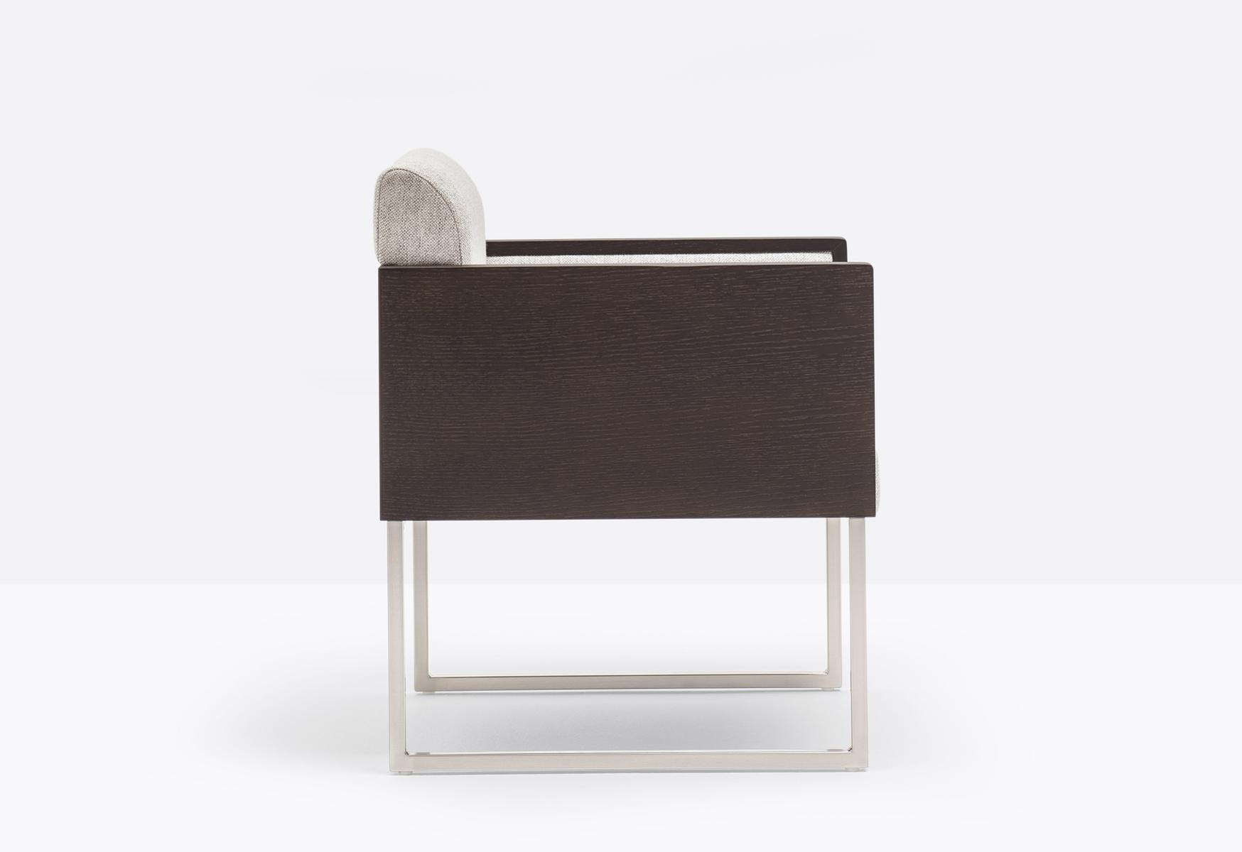 Sled base upholstered easy chair with armrests | Box 741 by Pedrali