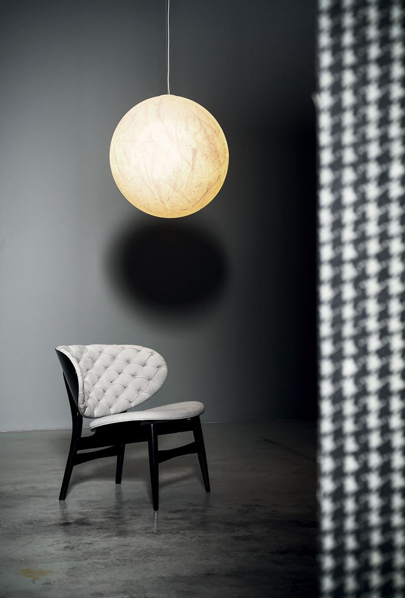 Tufted leather easy chair | Dalma by Baxter