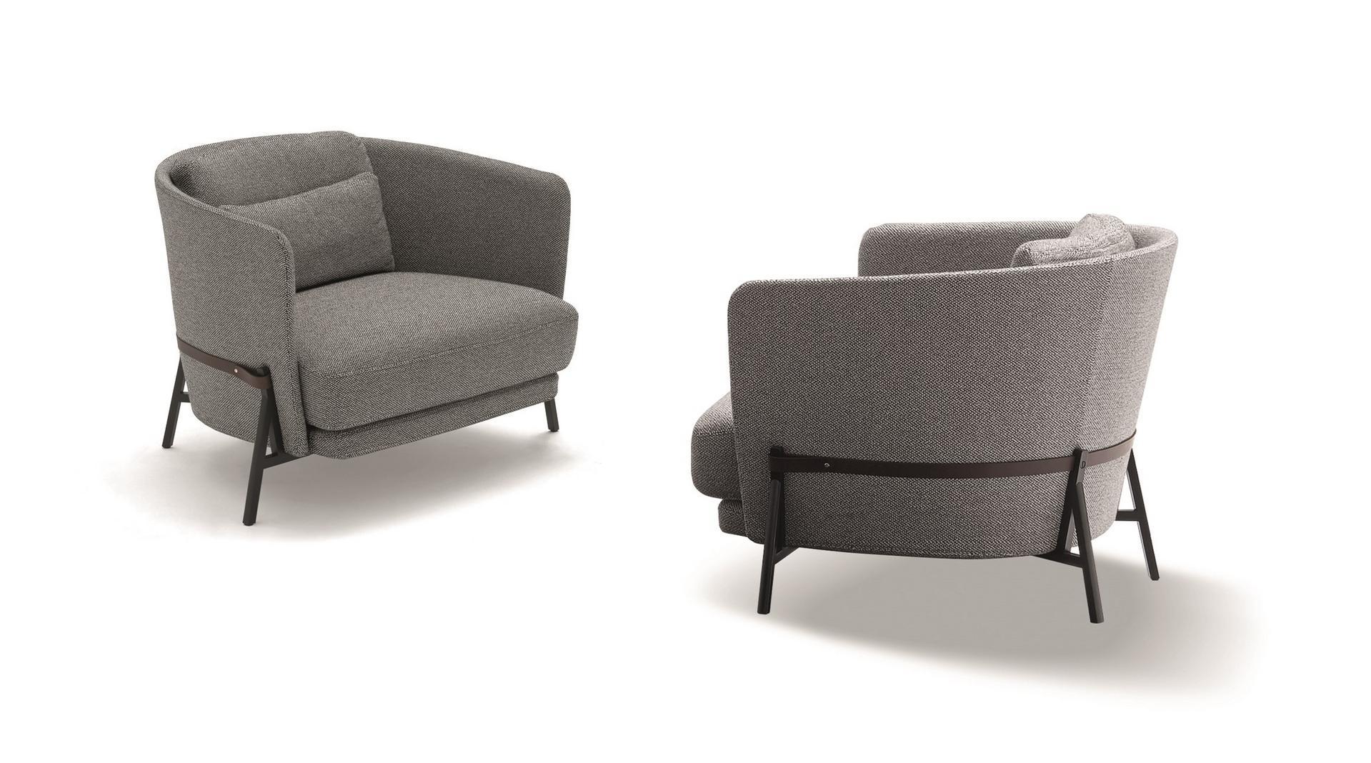 Fabric armchair with armrests with integrated magazine rack | Cradle by Arflex