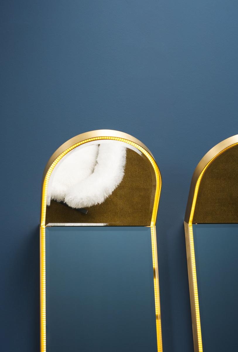 Wall-mounted brass mirror with integrated lighting | Stardust by Baxter