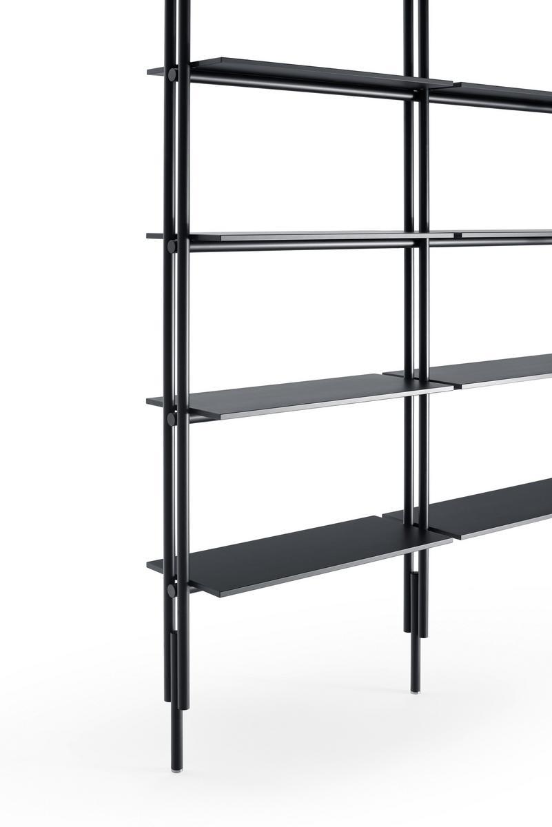 Open floor-ceiling mounted bookcase | Jack by B&B Italia