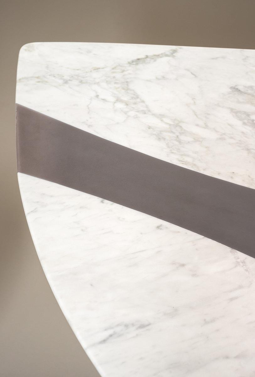 Oval marble table with base covered in leather | Ronchamp by Baxter