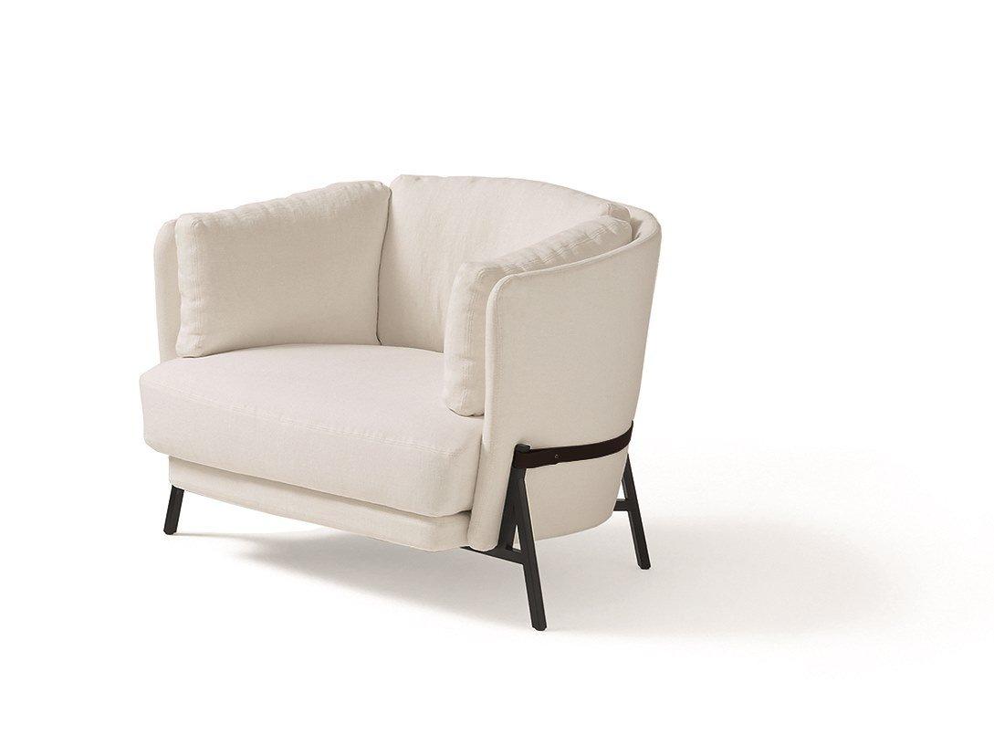 Fabric armchair with armrests with integrated magazine rack | Cradle by Arflex