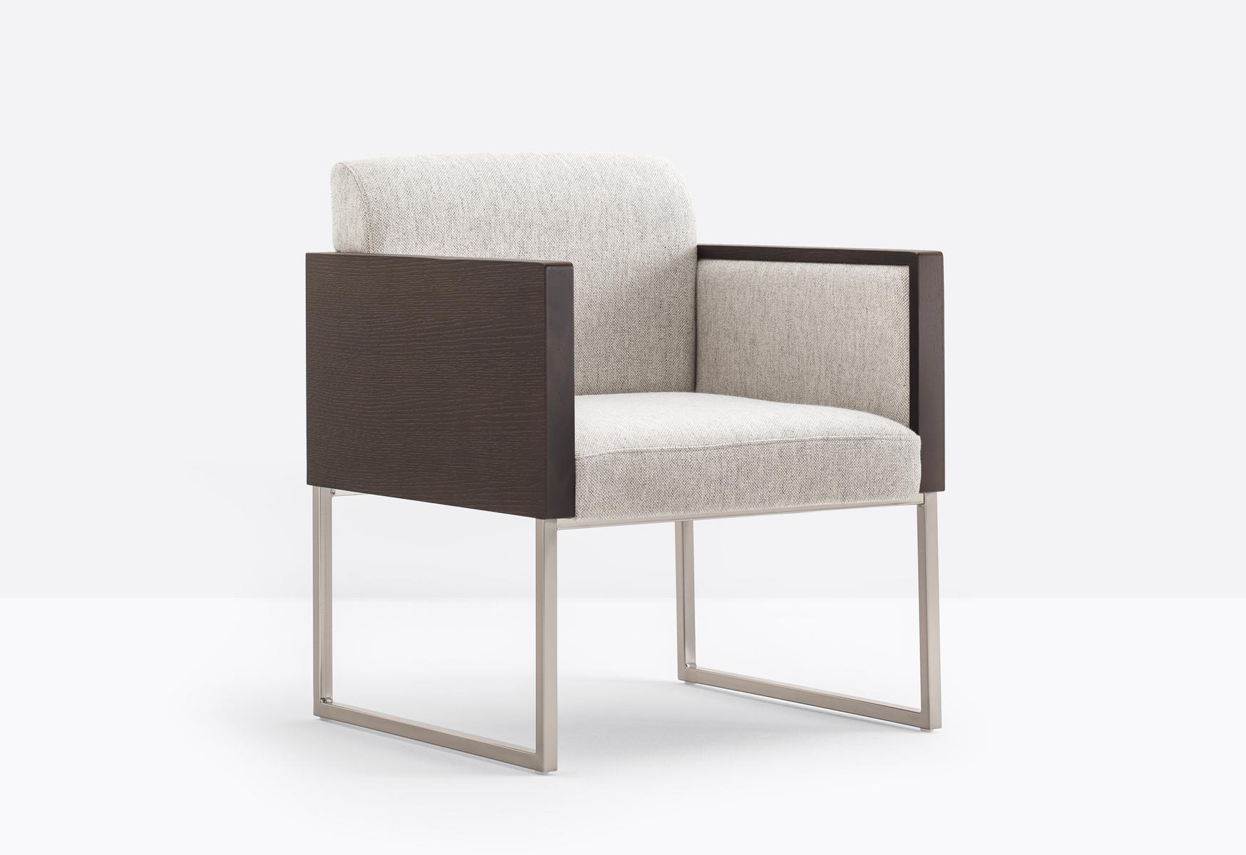 Sled base upholstered easy chair with armrests | Box 741 by Pedrali