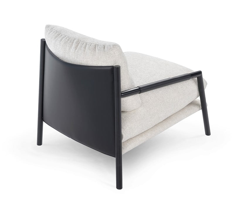 The Norman armchair offers a unique, forward-tilting design with a metal frame, regenerated leather upholstery, and a cushion-back for stylish, informal comfort. | Norman by Calia Italia