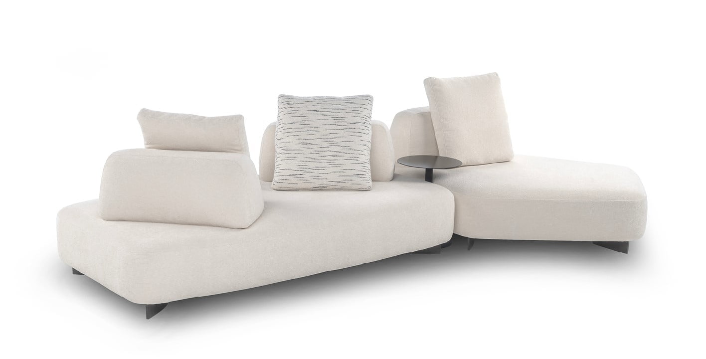 Modular sofa with moveable backrests and versatile configurations, providing flexible comfort and Italian-inspired design aesthetics for innovative living spaces. | Cremino by Calia Italia