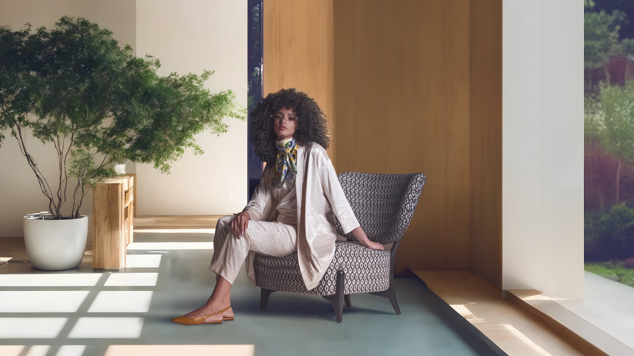 The 'Silla' armchair features a distinctive embracing backrest and sturdy external legs, offering both comfort and a stylized, Scandinavian-inspired design. | Silla by Calia Italia