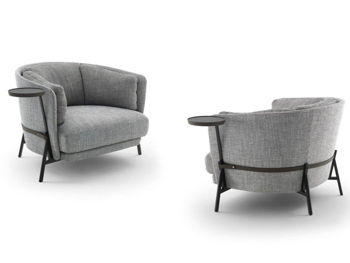 Fabric armchair with armrests with integrated magazine rack | Cradle by Arflex