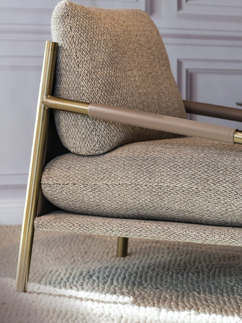 The Norman armchair offers a unique, forward-tilting design with a metal frame, regenerated leather upholstery, and a cushion-back for stylish, informal comfort. | Norman by Calia Italia