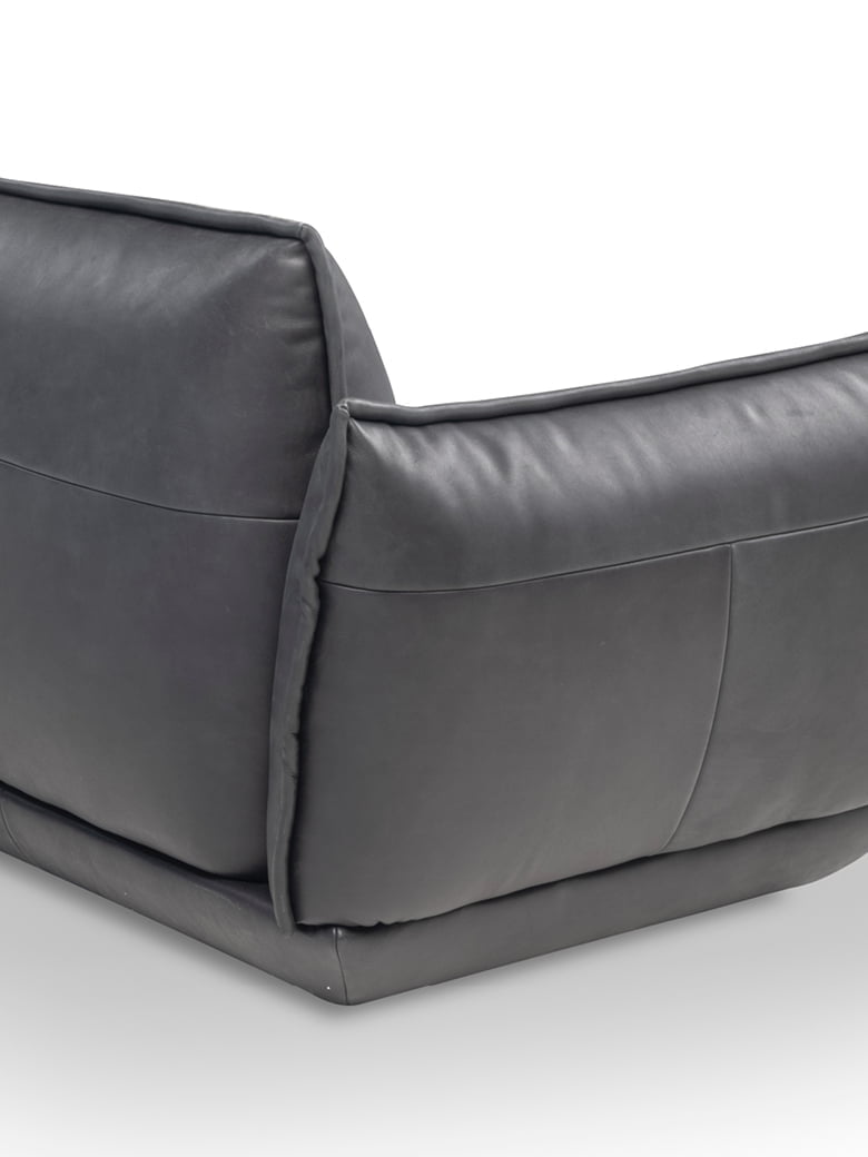 The Éclair sofa features an innovative design with sculptural volumes, decorative stitching, and comfortable seating, available in various sizes for modern and attractive interiors. | L'Eclair by Calia Italia