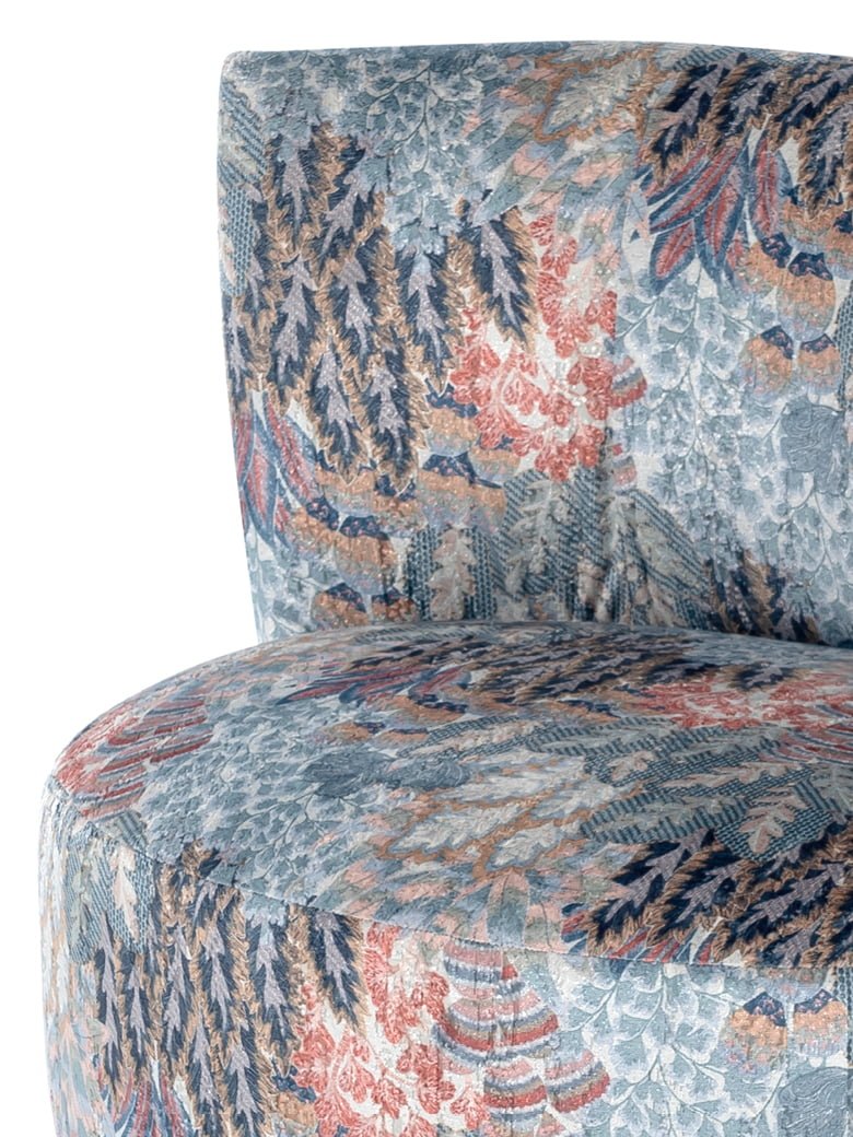 The Drusilla easy chair combines 70's style with comfort, featuring an egg-shaped design and a cozy backrest for relaxed arm support. | Drusilla by Calia Italia