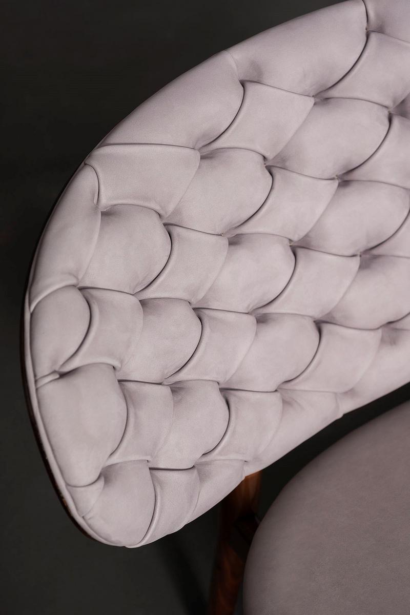 Tufted leather easy chair | Dalma by Baxter