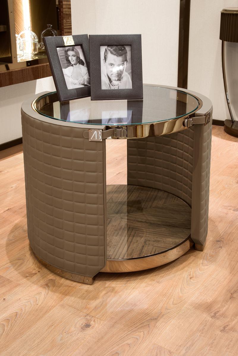 Round coffee table covered in leather and glass top | Rupert by Bruno Zampa