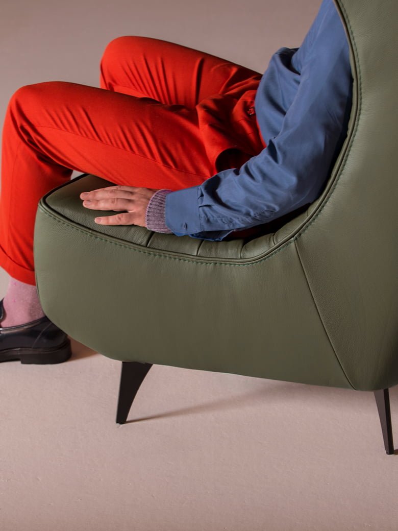 The 'Gerrit' armchair is a comfortable, modern classic with quilting detail that extends to a matching footstool. Optional swivel base and customizable finishes cater to personal or office use. | Gerrit by Calia Italia