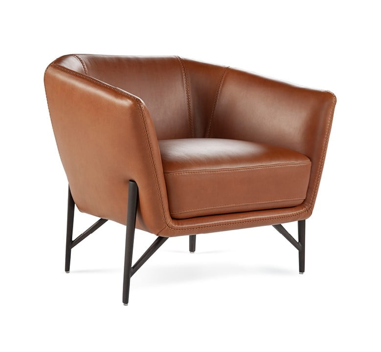 Contemporary armchair with a slim, enveloping structure and soft cushion for comfort, ideal for space efficiency without compromising on style. | Venere by Calia Italia