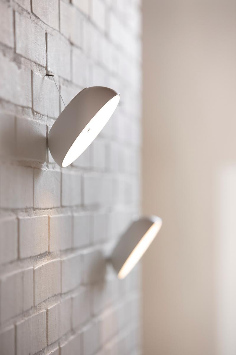 Multifunctional portable wall lamp | Float by Axolight