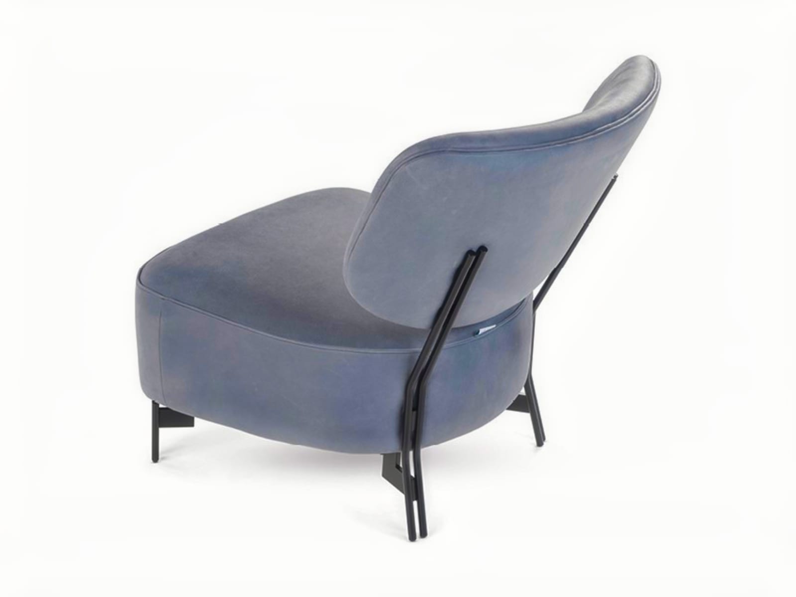 The 'Silla' armchair features a distinctive embracing backrest and sturdy external legs, offering both comfort and a stylized, Scandinavian-inspired design. | Silla by Calia Italia