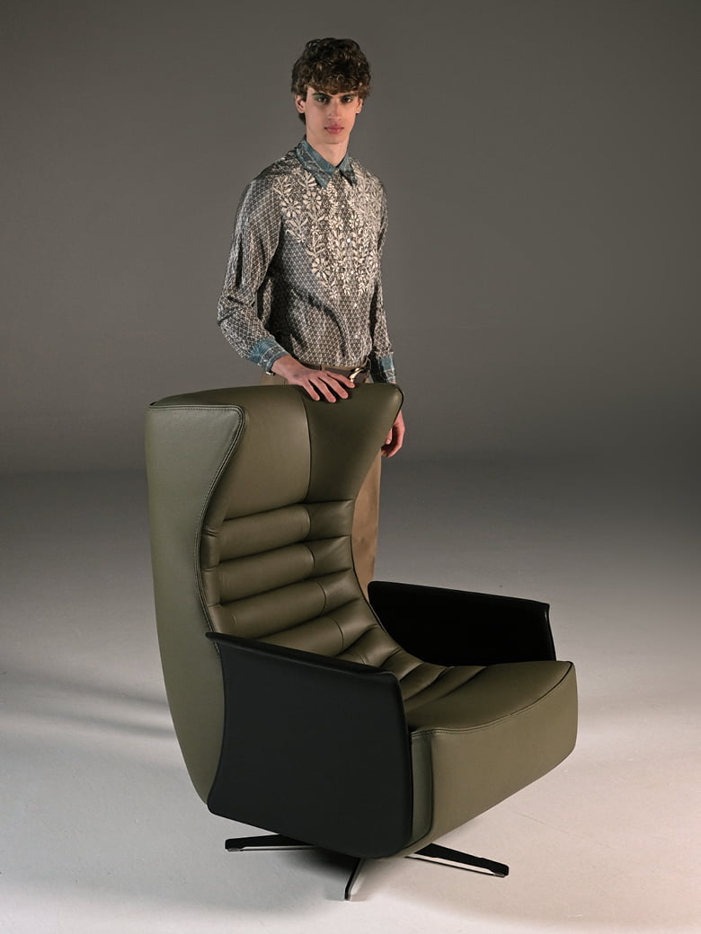 The 'Gerrit' armchair is a comfortable, modern classic with quilting detail that extends to a matching footstool. Optional swivel base and customizable finishes cater to personal or office use. | Gerrit by Calia Italia