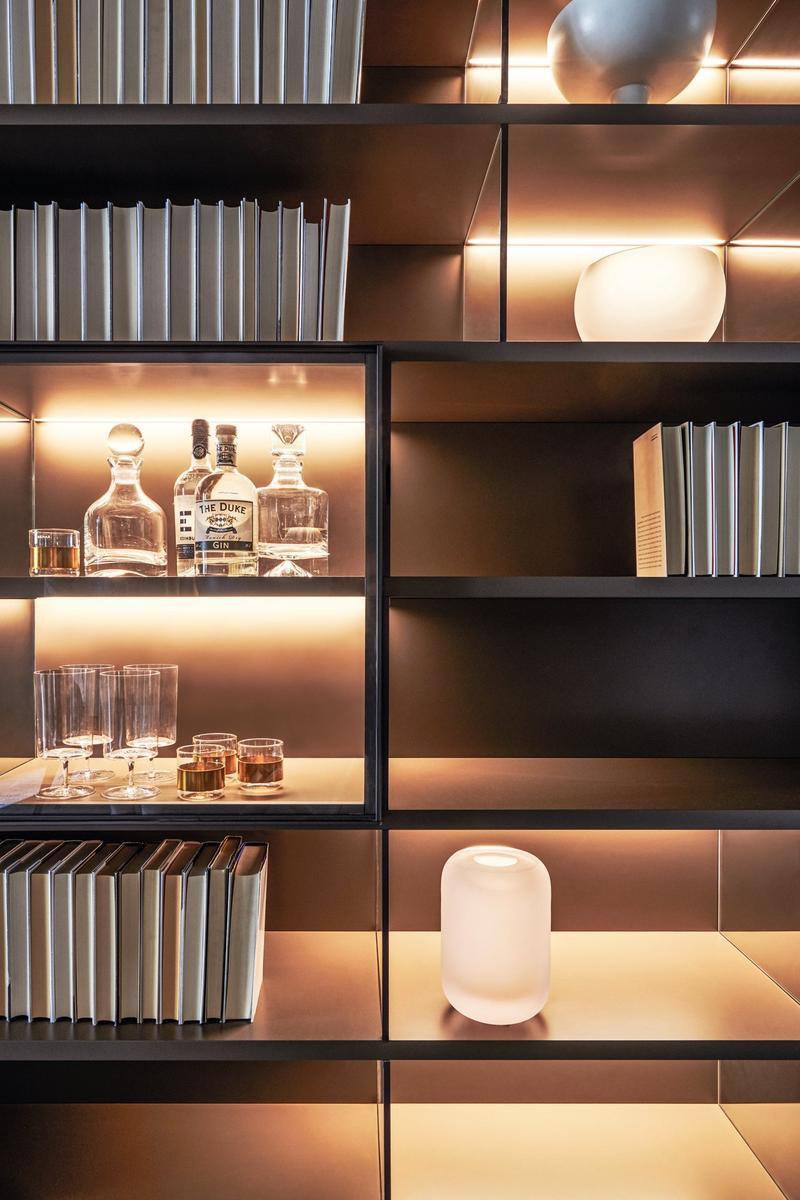 Sectional wooden storage wall with integrated lighting | 505 by Molteni