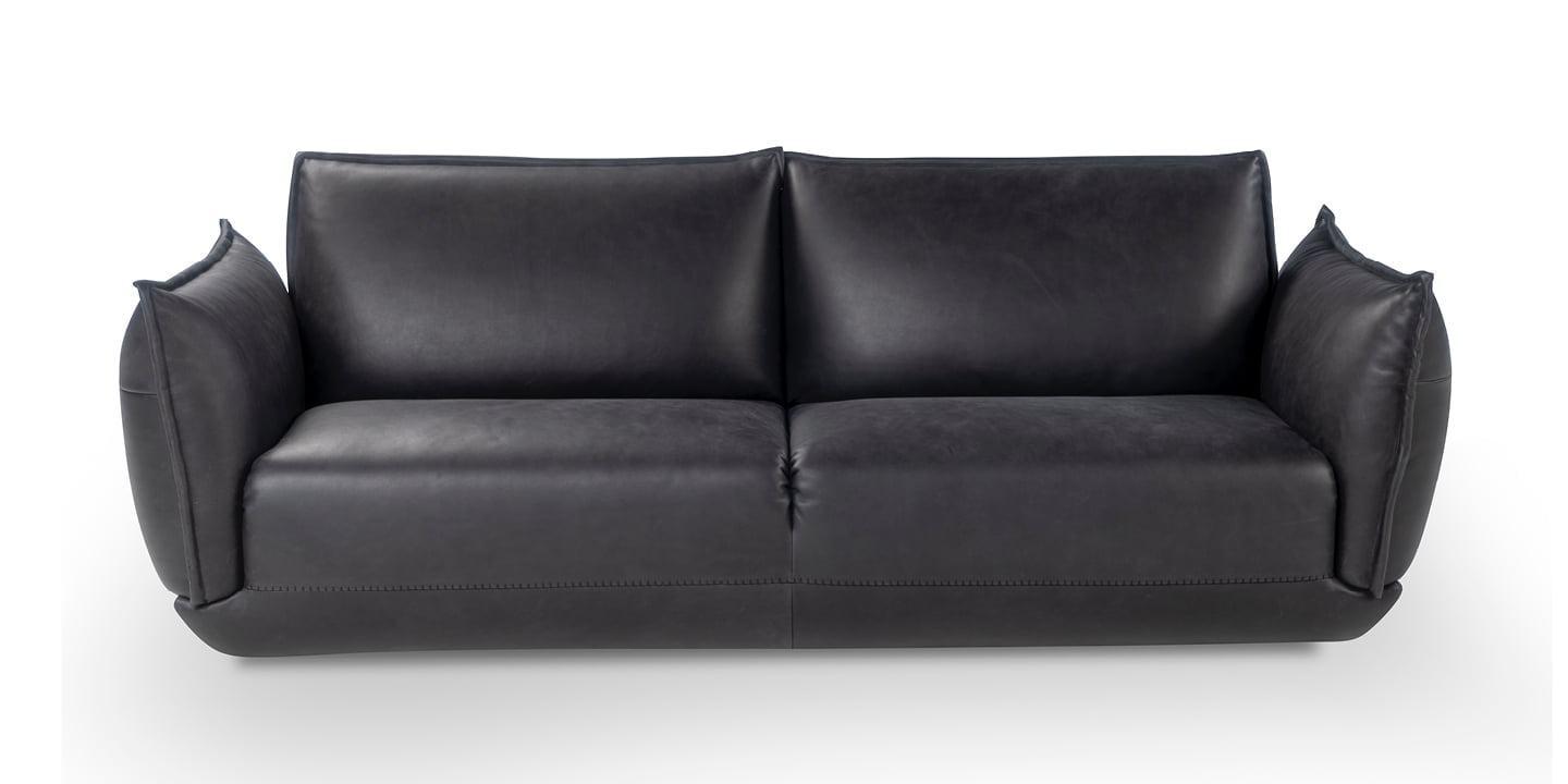The Éclair sofa features an innovative design with sculptural volumes, decorative stitching, and comfortable seating, available in various sizes for modern and attractive interiors. | L'Eclair by Calia Italia