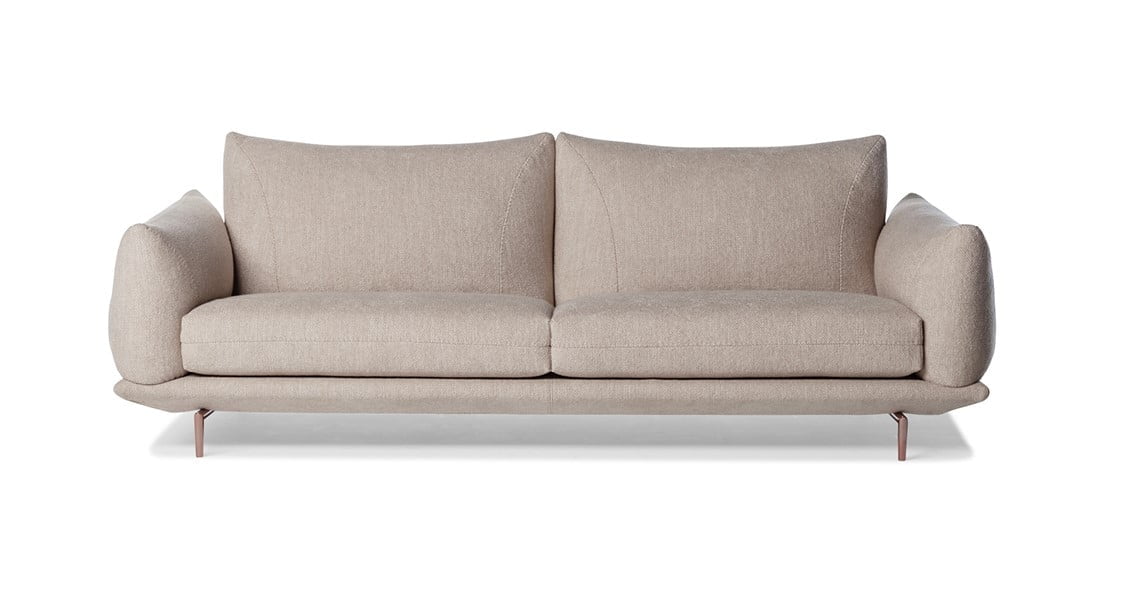 Elegant sectional with heightened backrests for superior comfort, minimal base, and decorative stitching, combining sophistication with supported relaxation. | Dragées by Calia Italia