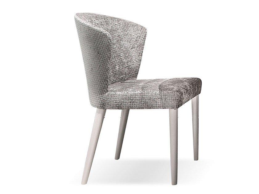 Upholstered chair | Tweet by Corte Zari