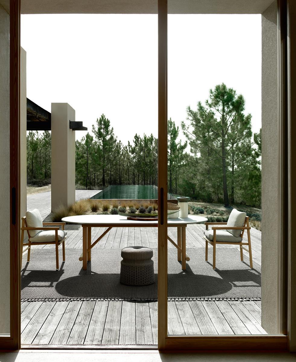 Oval solid wood and Serpentine stone garden table | Ayana by B&B Italia