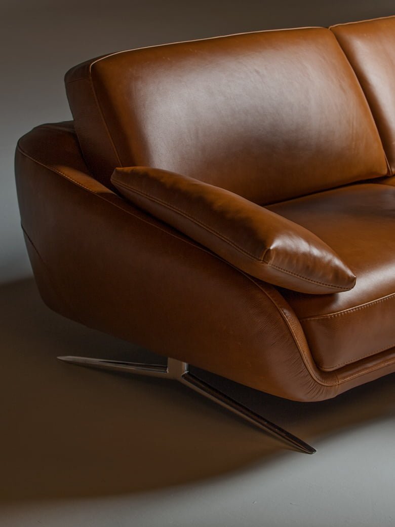 The 'Regal_e' is a versatile, modular sofa with adjustable backrests and electric leg-rests for high comfort, suitable for spacious interiors, and offers various upholstery and finish options. | Regal_e by Calia Italia