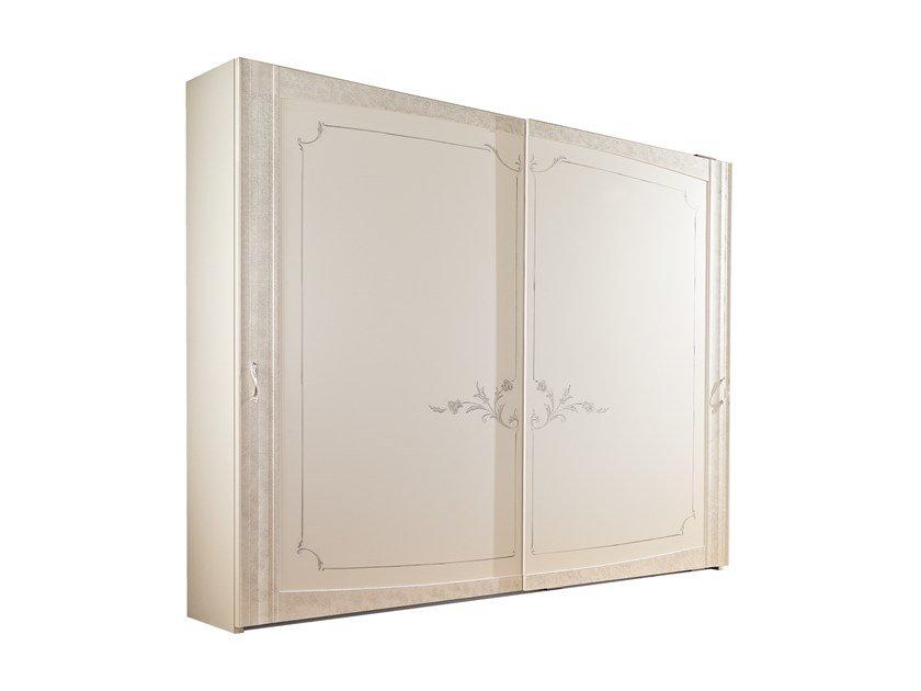 Built-in wooden wardrobe with sliding doors | Vanity by Barnini Oseo