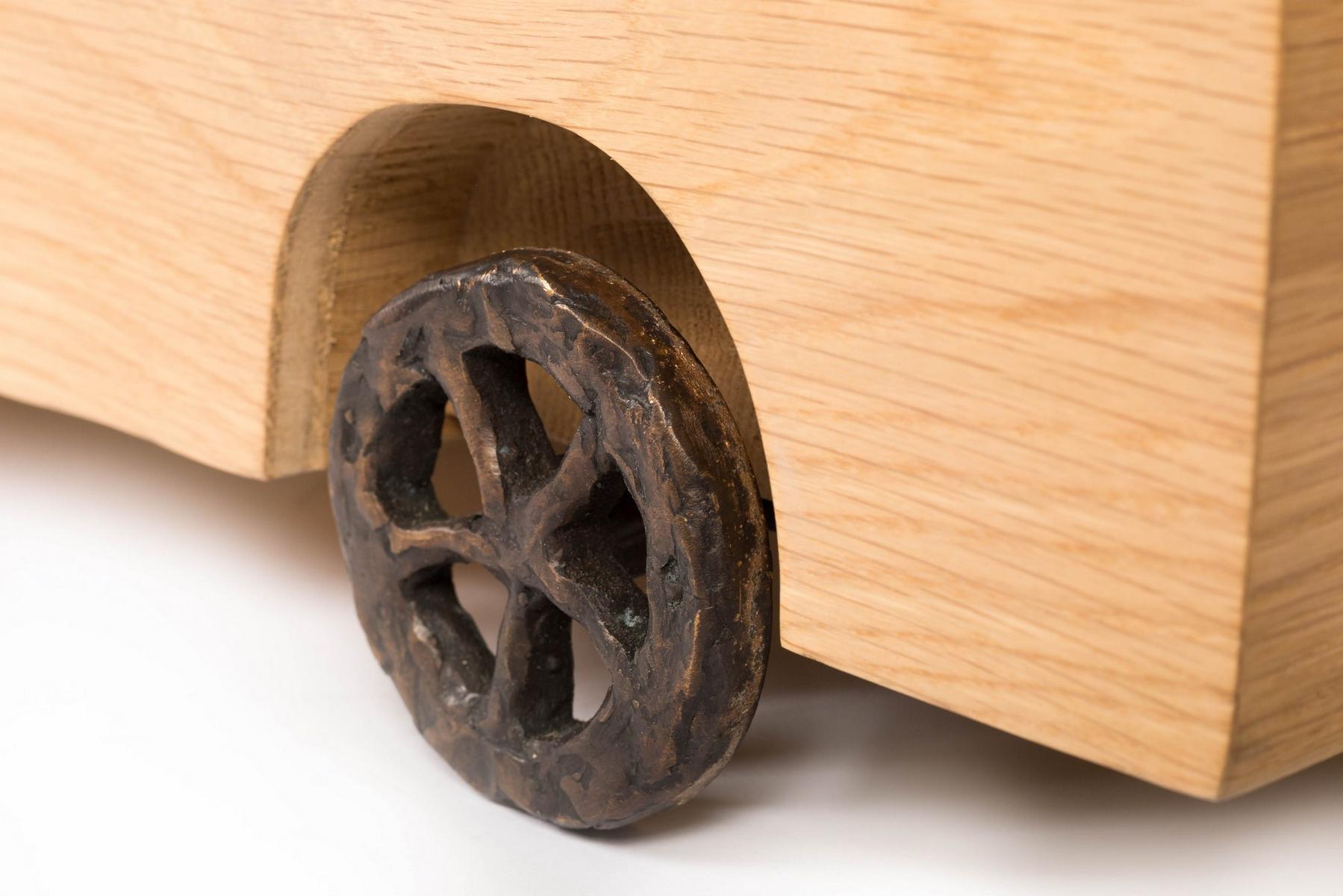 Oak high side table with integrated magazine rack | Turbo Table by Moooi