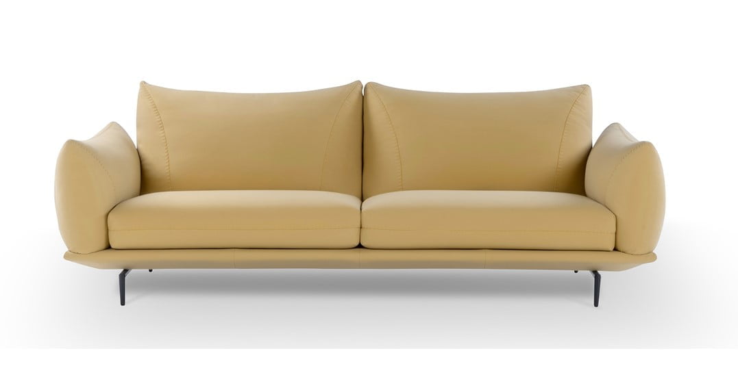 Elegant sectional with heightened backrests for superior comfort, minimal base, and decorative stitching, combining sophistication with supported relaxation. | Dragées by Calia Italia