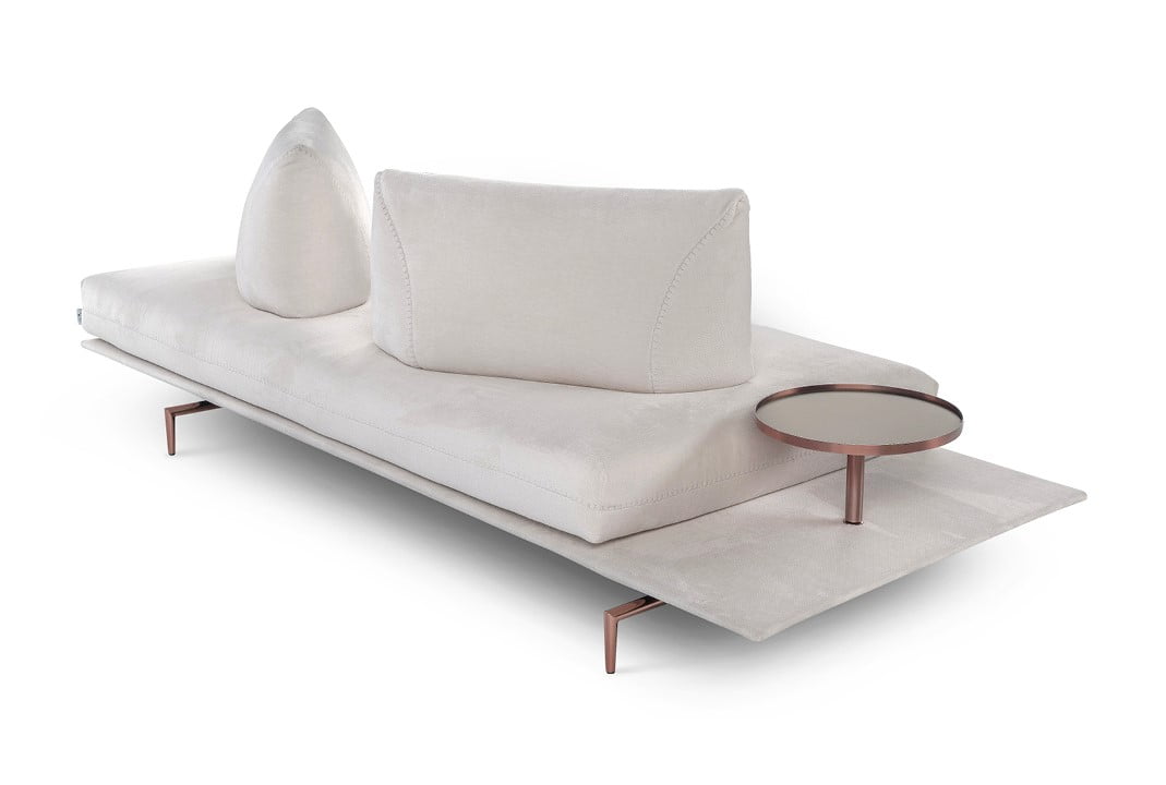 A versatile sofa offering adjustable backrests for multiple seating positions, elegant design stitching, and optional integrated table surfaces, elevated by stylish metal feet. | Gianduiotto by Calia Italia