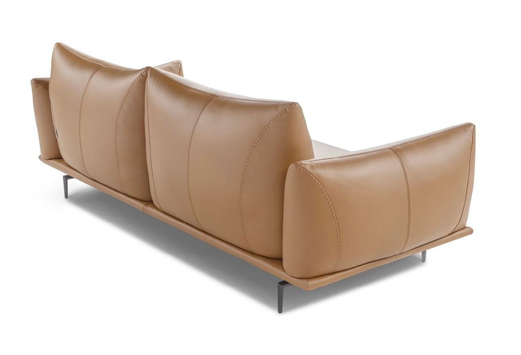 Elegant sectional with heightened backrests for superior comfort, minimal base, and decorative stitching, combining sophistication with supported relaxation. | Dragées by Calia Italia