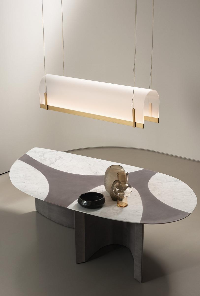 Oval marble table with base covered in leather | Ronchamp by Baxter