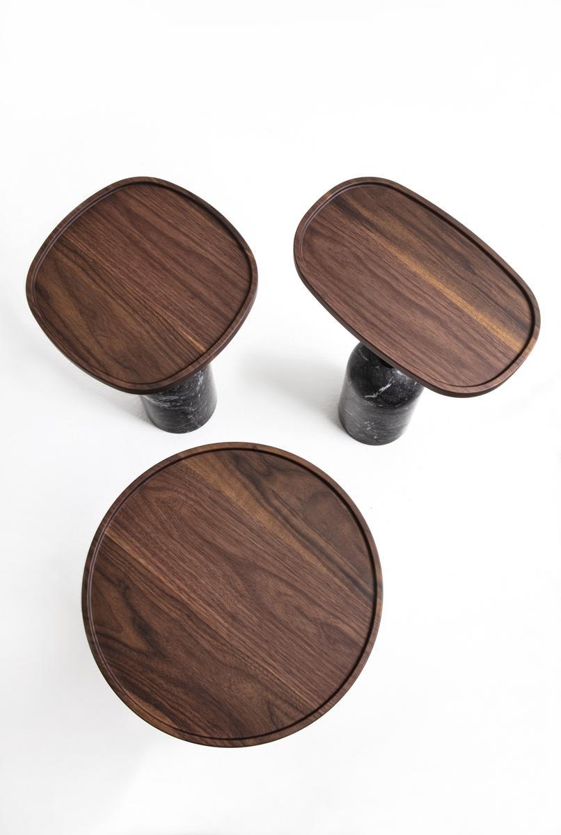 Oval marble coffee table and canaletta walnut top | Ekero by Porada