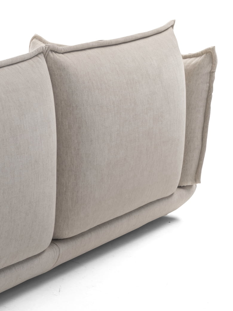The Éclair sofa features an innovative design with sculptural volumes, decorative stitching, and comfortable seating, available in various sizes for modern and attractive interiors. | L'Eclair by Calia Italia