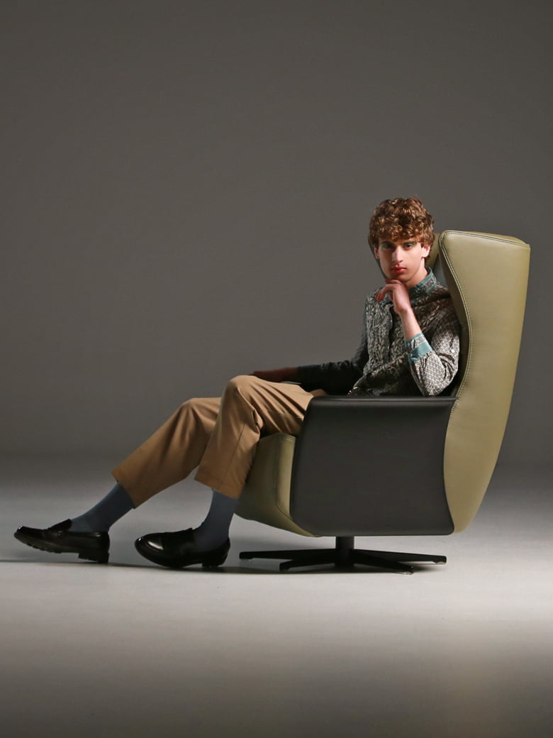 The 'Gerrit' armchair is a comfortable, modern classic with quilting detail that extends to a matching footstool. Optional swivel base and customizable finishes cater to personal or office use. | Gerrit by Calia Italia