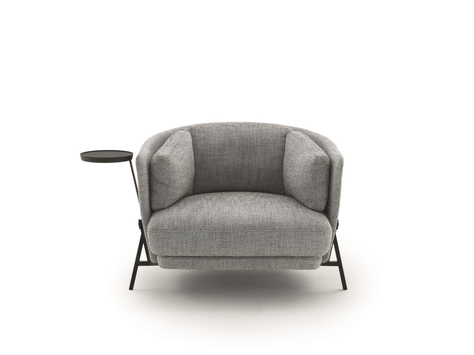 Fabric armchair with armrests with integrated magazine rack | Cradle by Arflex