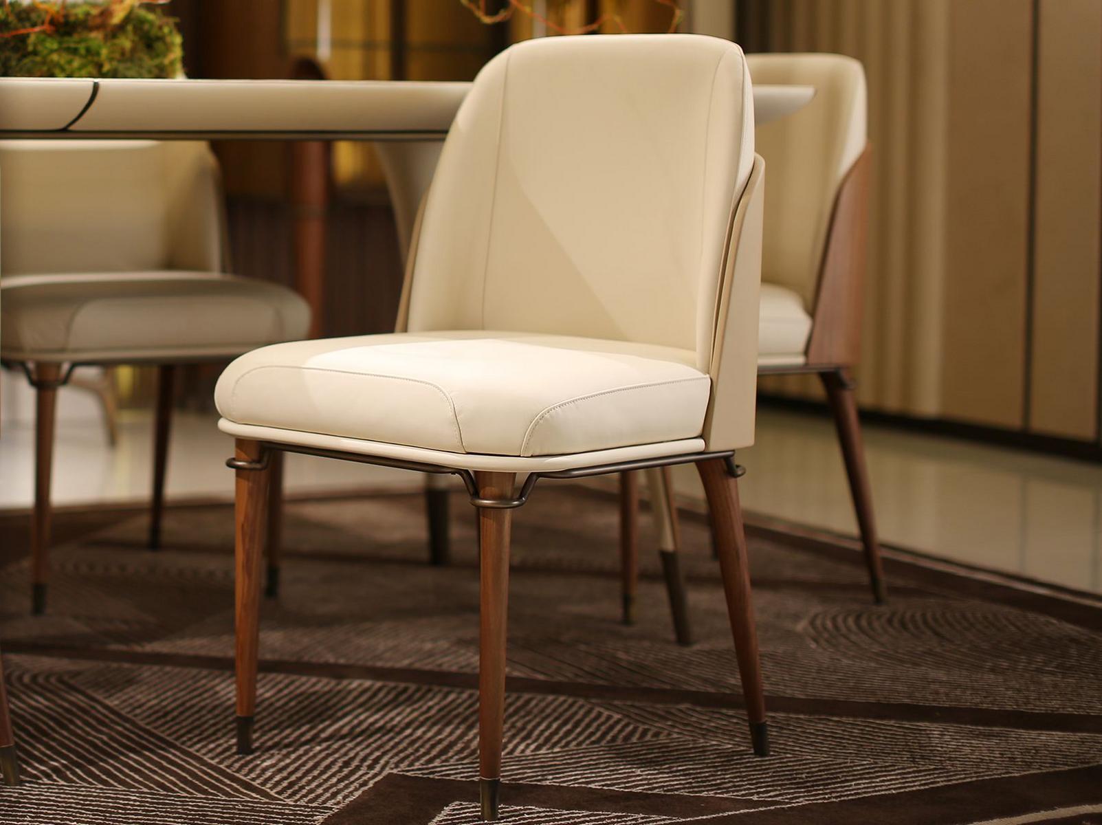 Upholstered leather chair | Melting Light by Turri
