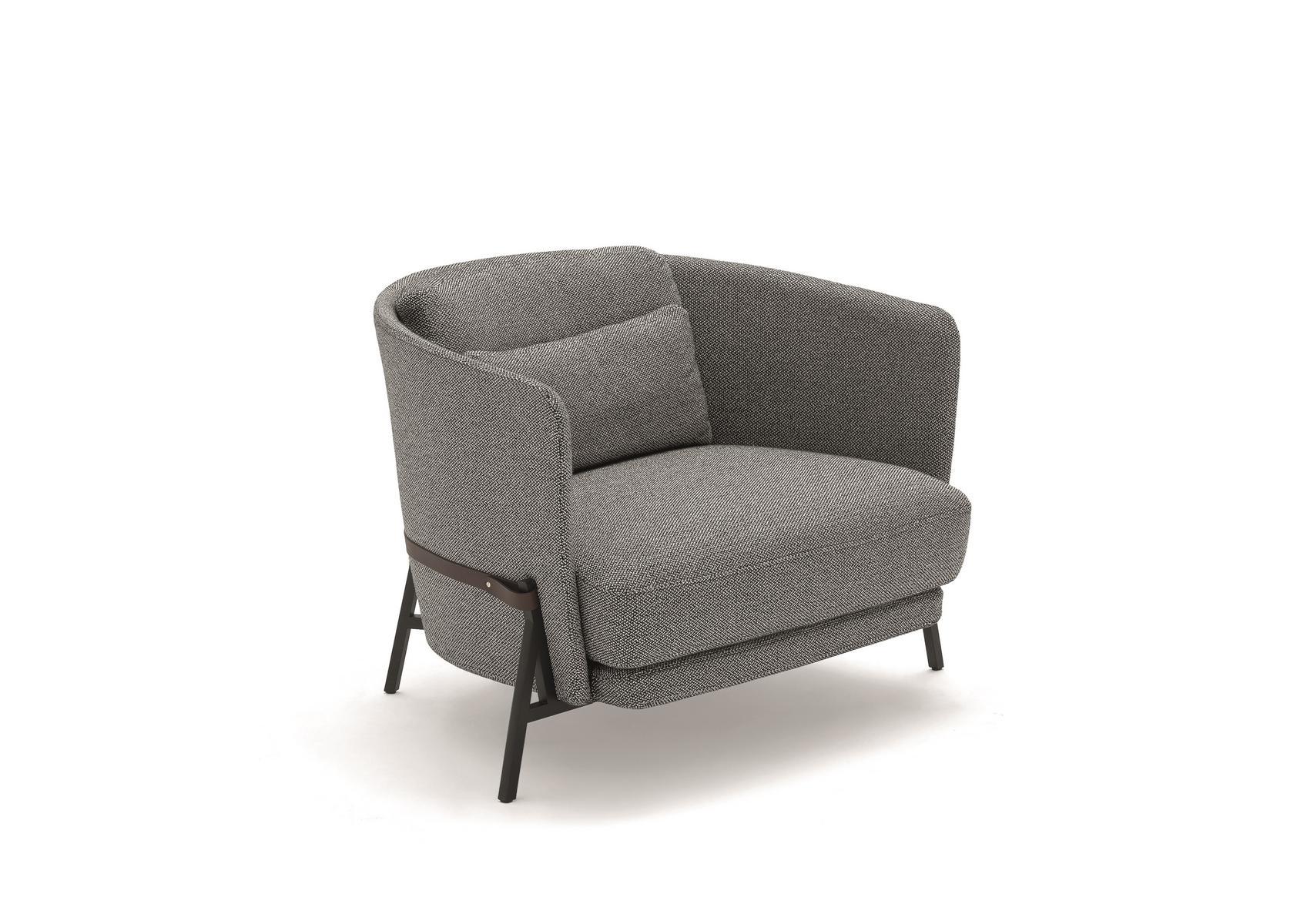 Fabric armchair with armrests with integrated magazine rack | Cradle by Arflex