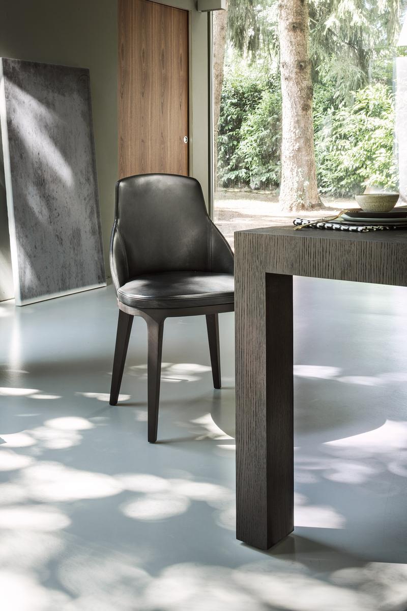 Upholstered leather chair with armrests | Lucy by Lema