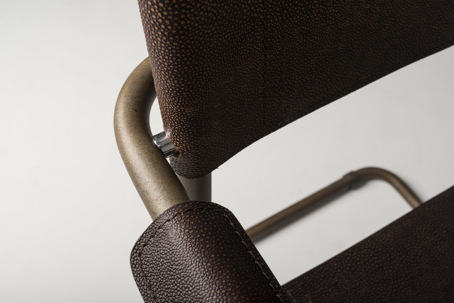 Cantilever Corten™ and tanned leather chair with armrests | Meccanica by Mantellassi 1926