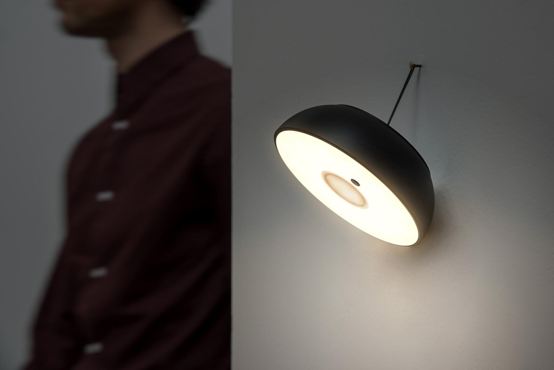 Multifunctional portable wall lamp | Float by Axolight