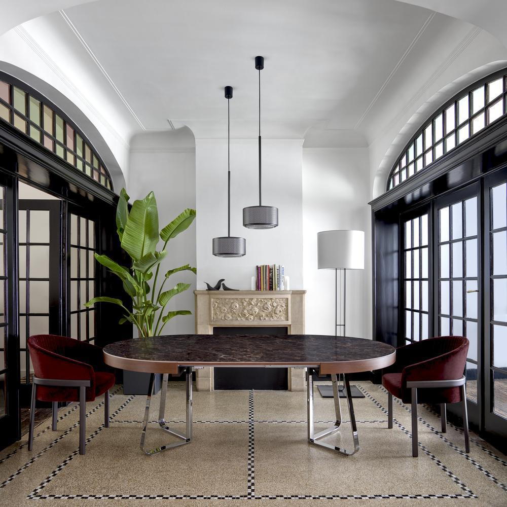 Extending round porcelain stoneware dining table | Ava by Ligne Roset