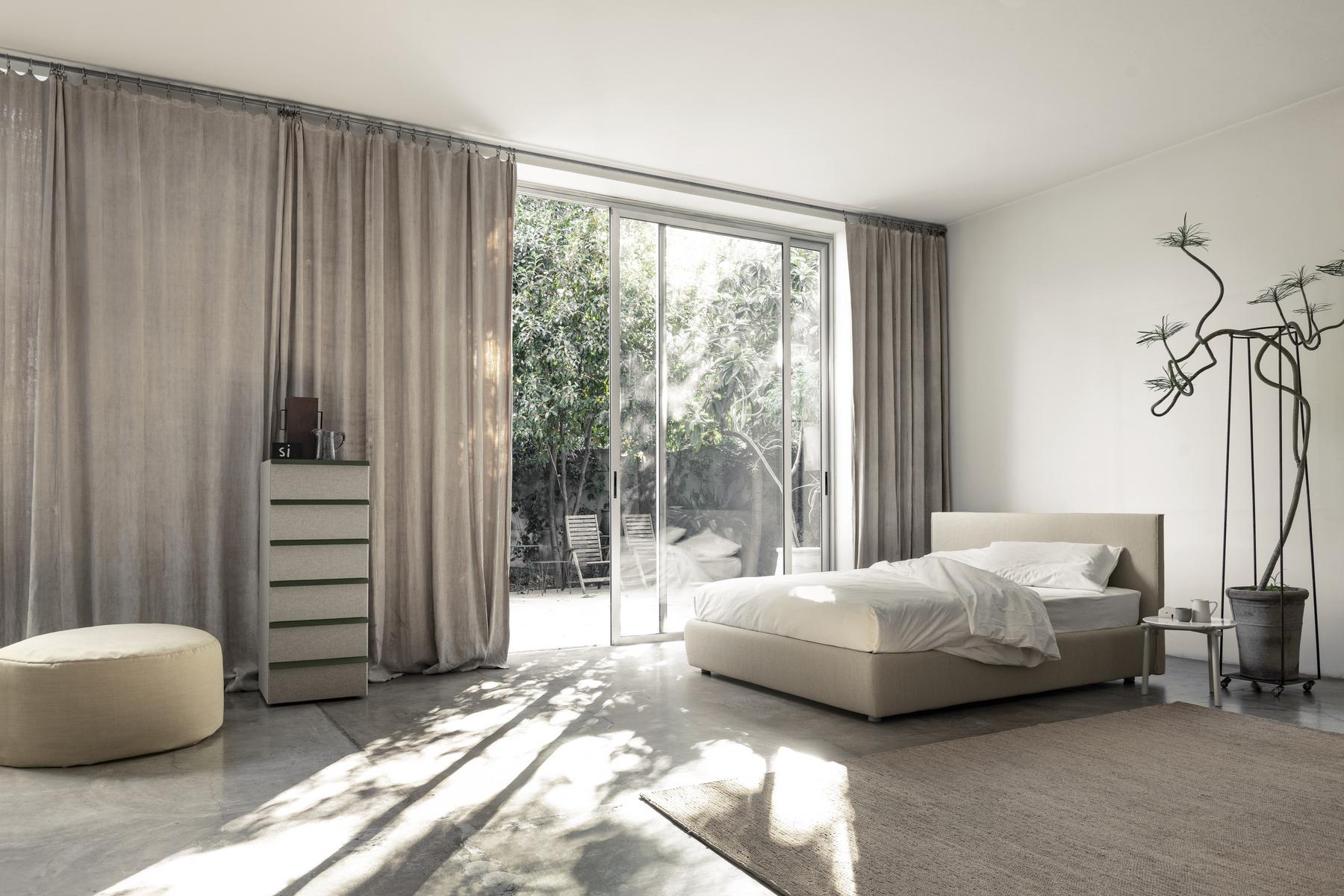 Storage bed with upholstered headboard | Metropolitan by Bolzan letti