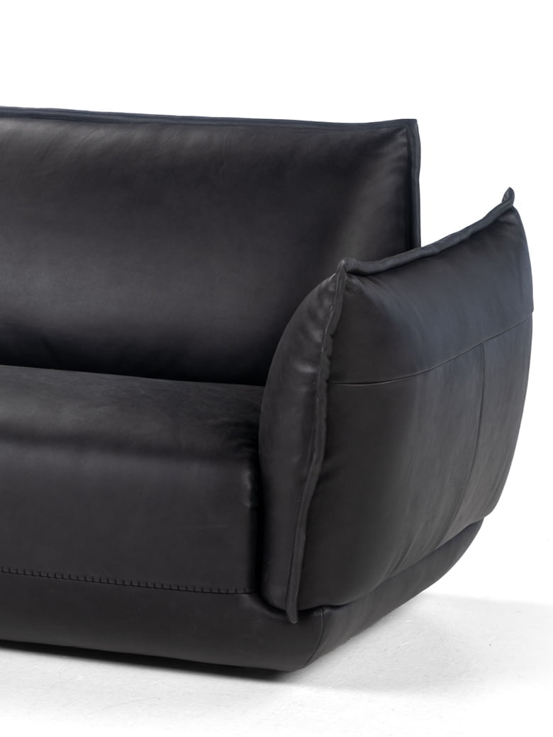 The Éclair sofa features an innovative design with sculptural volumes, decorative stitching, and comfortable seating, available in various sizes for modern and attractive interiors. | L'Eclair by Calia Italia