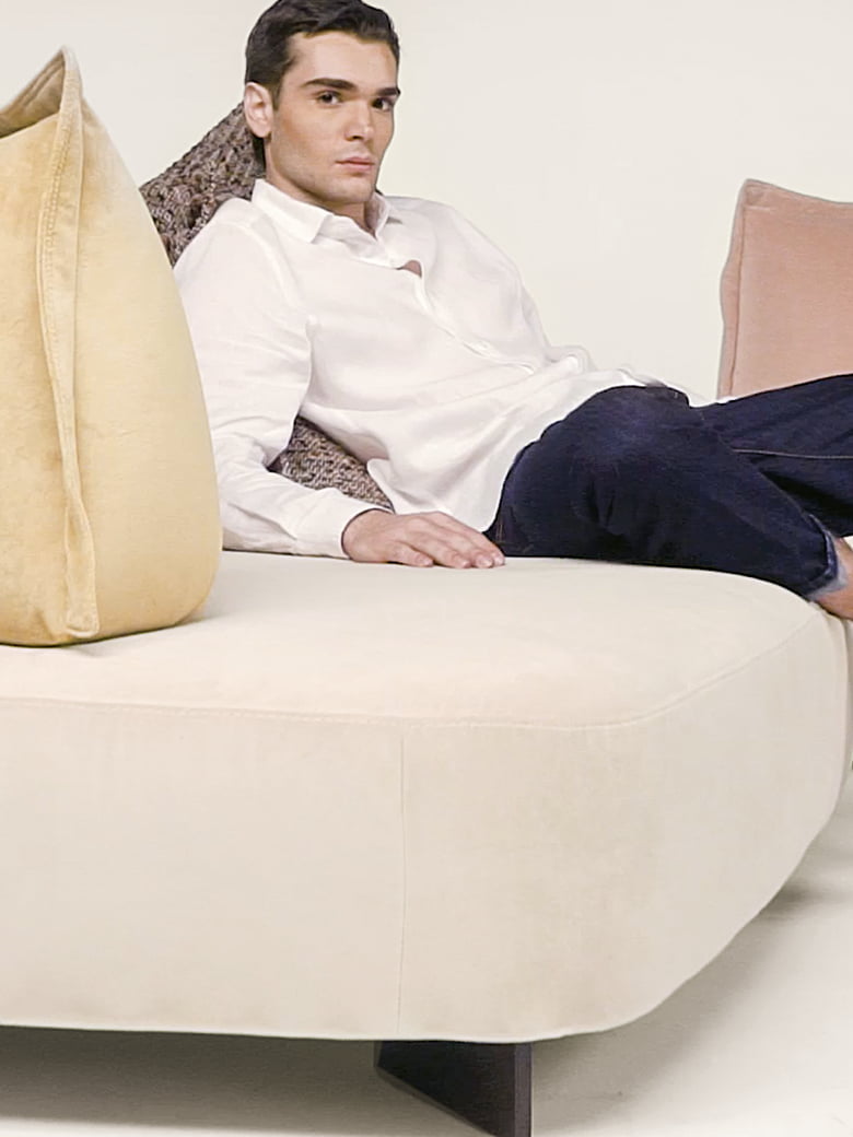 Modular sofa with moveable backrests and versatile configurations, providing flexible comfort and Italian-inspired design aesthetics for innovative living spaces. | Cremino by Calia Italia