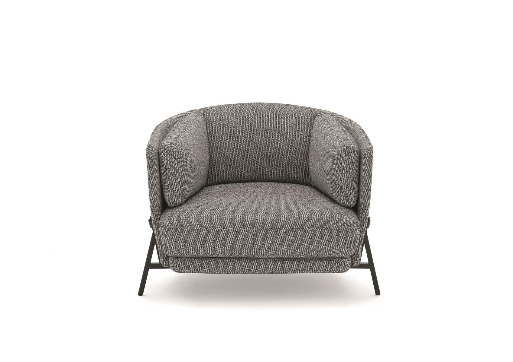 Fabric armchair with armrests with integrated magazine rack | Cradle by Arflex